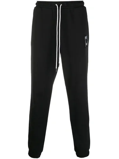 Puma Logo-patch Tapered Track Pants In Black