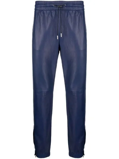 Saint Laurent Leather Tapered-leg Trousers In Blau