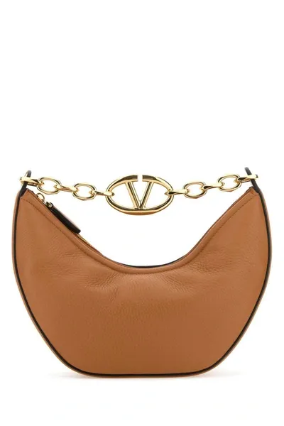 Valentino Garavani Handbags. In Camel